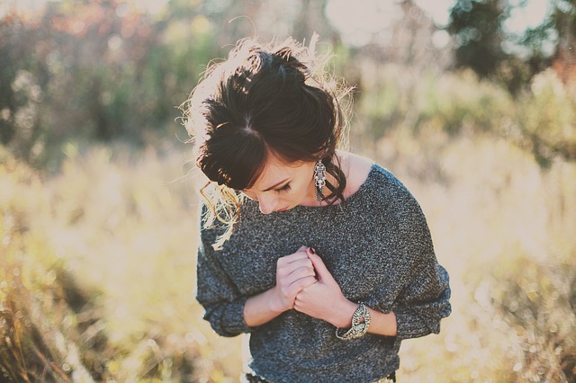 Emotional girl standing in Forest