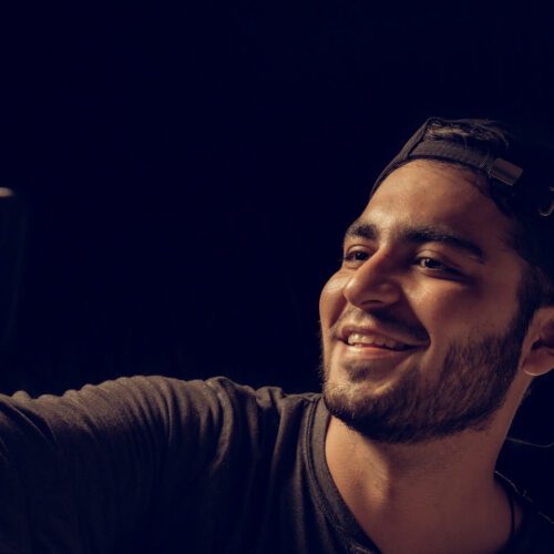 Narcissistic person smiling while taking selfie