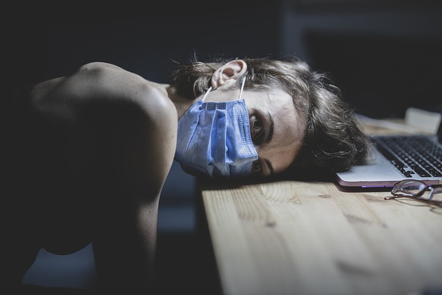 Girl lying down with Covid-19 mask