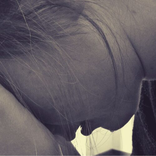 woman crying in hands