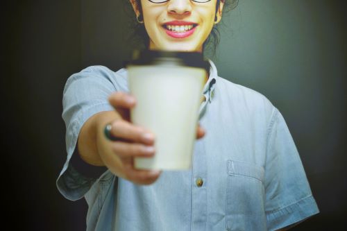Confident woman sharing coffee